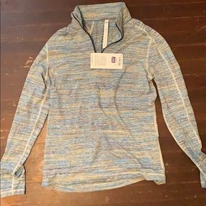 Large Surge warm half zip by lululemon.